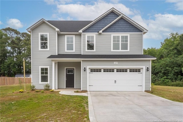 207 E Main St, Lumber Bridge, NC 28357 - view of front facade featuring an attached garage and concrete driveway