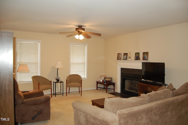 living room featuring ceiling fan, light carpet, and a healthy amount of sunlight