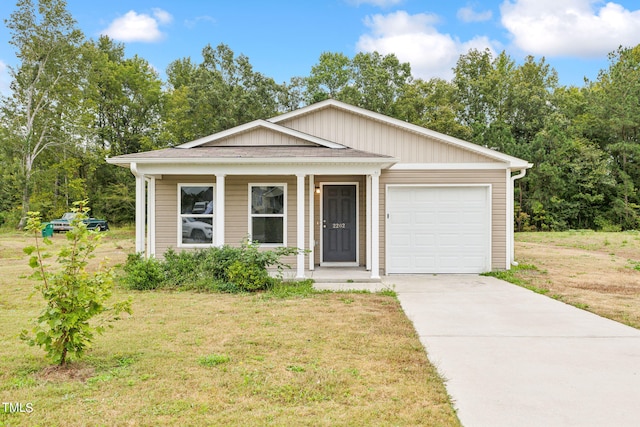 view of front of home with a garage and a front lawn