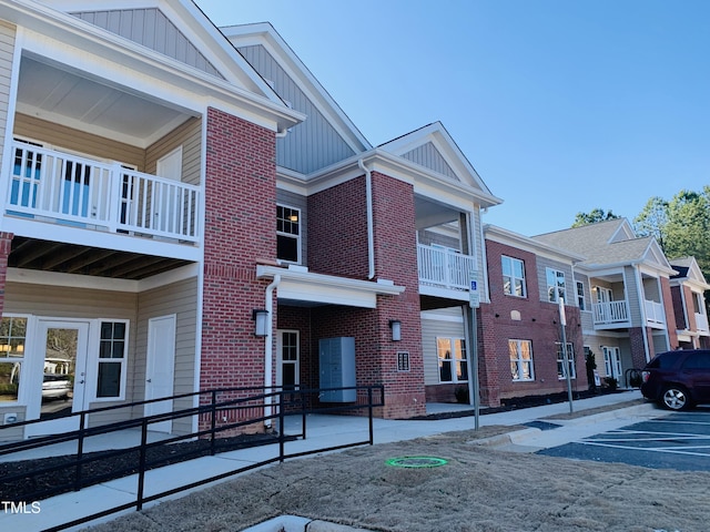 view of property featuring uncovered parking