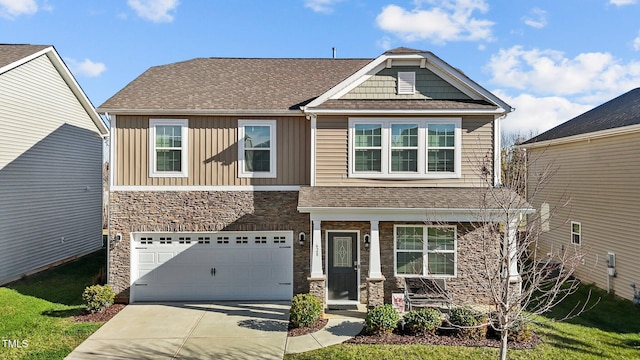 craftsman-style home with a garage and a front lawn