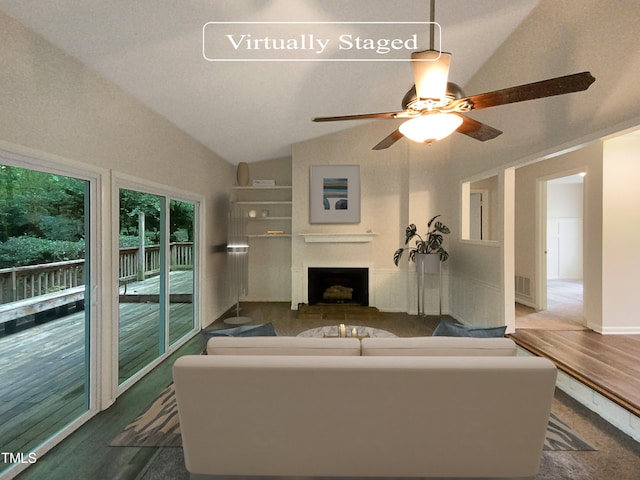 unfurnished living room with lofted ceiling, ceiling fan, and hardwood / wood-style floors