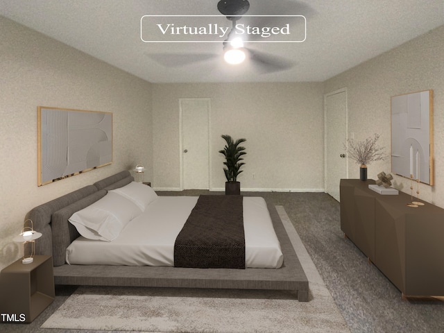 carpeted bedroom featuring a textured ceiling and ceiling fan