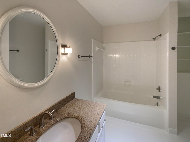 bathroom with washtub / shower combination, vanity, and tile patterned floors