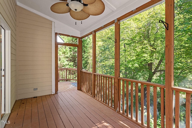 unfurnished sunroom featuring vaulted ceiling and ceiling fan