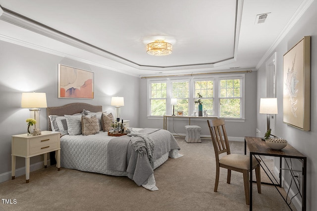 bedroom with ornamental molding, light carpet, and a tray ceiling