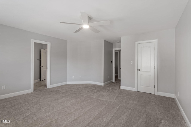 carpeted empty room featuring ceiling fan