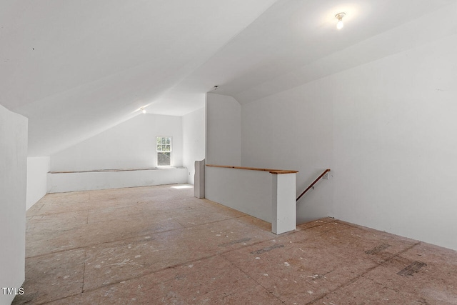 additional living space featuring vaulted ceiling