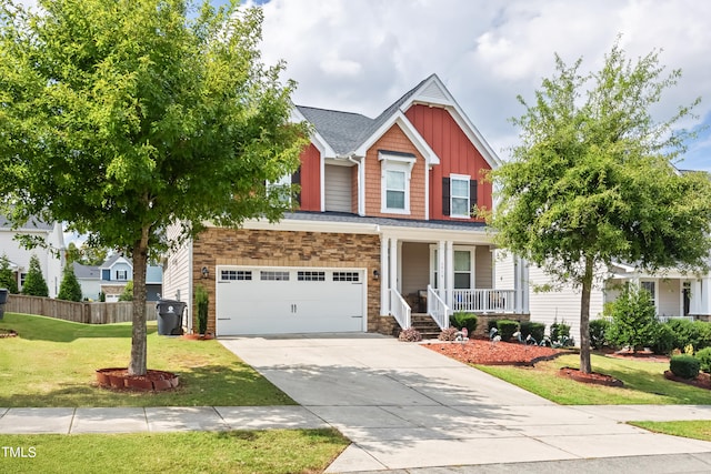 craftsman house featuring covered porch, a front yard, and a garage