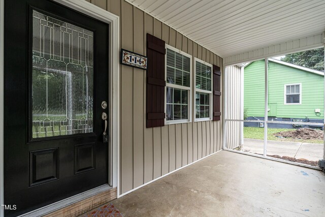 doorway to property with a porch