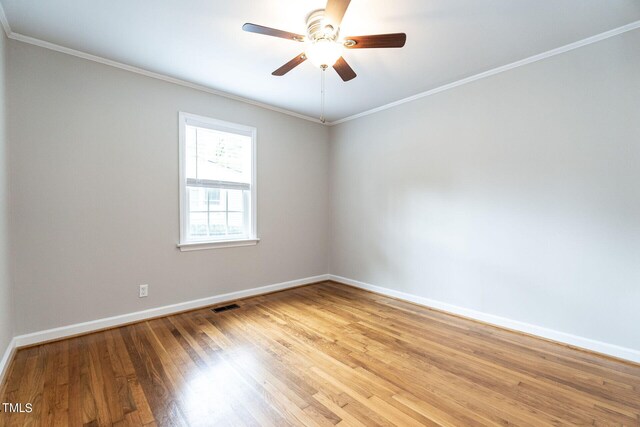 unfurnished room with light hardwood / wood-style flooring, ceiling fan, and crown molding