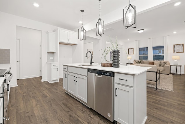 kitchen with stainless steel dishwasher, pendant lighting, white cabinets, and a kitchen island with sink