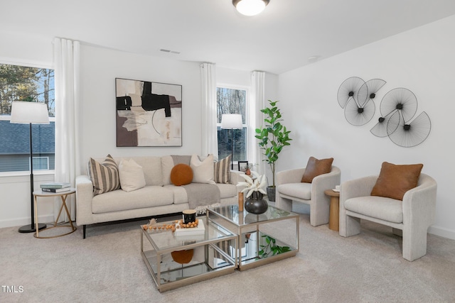 carpeted living room featuring a healthy amount of sunlight