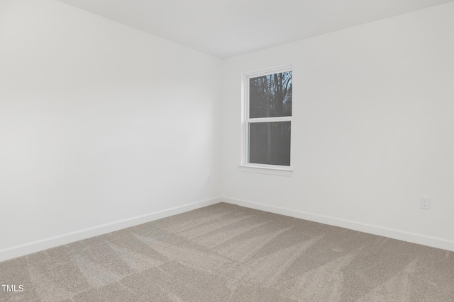 spare room featuring carpet floors