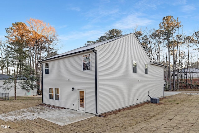 view of home's exterior featuring a patio and central AC