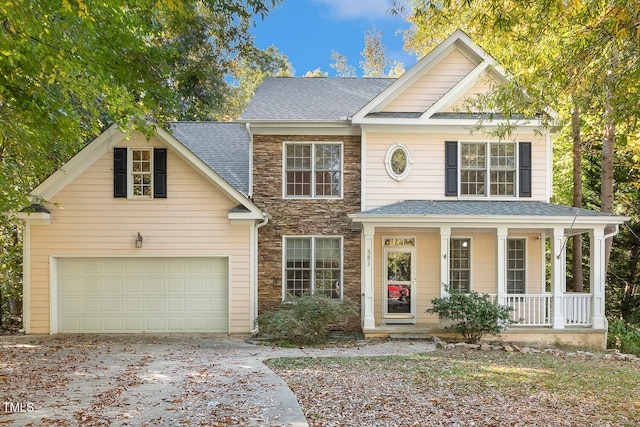 view of front of house featuring covered porch and a garage