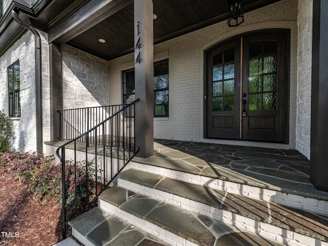 144 W Beech Slope Ct, Chapel Hill, NC 27517 - entrance to property with covered porch, brick siding, and french doors