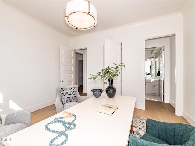 144 W Beech Slope Ct, Chapel Hill, NC 27517 - office area featuring baseboards, a sink, ornamental molding, and light wood-style flooring