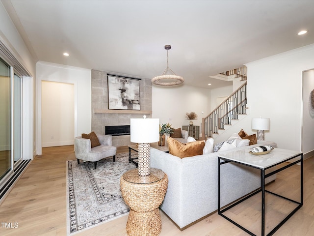 144 W Beech Slope Ct, Chapel Hill, NC 27517 - living room featuring light wood-style floors, baseboards, stairway, recessed lighting, and a tile fireplace