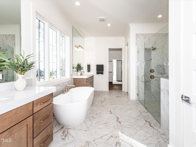 144 W Beech Slope Ct, Chapel Hill, NC 27517 - full bath featuring marble finish floor, a freestanding tub, recessed lighting, two vanities, and a marble finish shower
