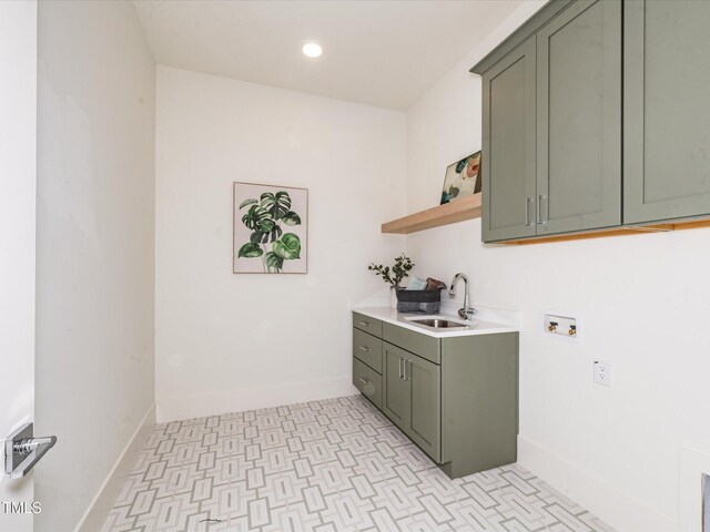 144 W Beech Slope Ct, Chapel Hill, NC 27517 - washroom with washer hookup, cabinet space, a sink, baseboards, and light floors