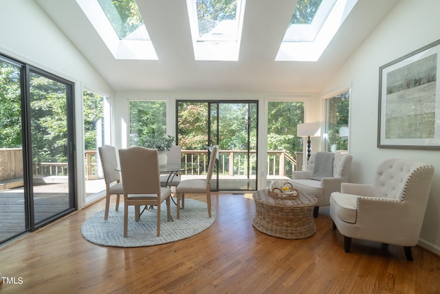 sunroom / solarium with lofted ceiling and a healthy amount of sunlight