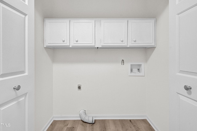 laundry area featuring hookup for an electric dryer, hookup for a washing machine, cabinets, and light wood-type flooring