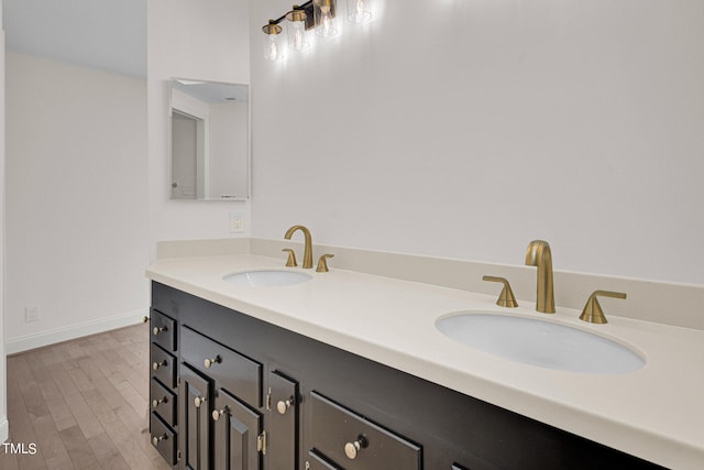 bathroom with vanity and hardwood / wood-style flooring