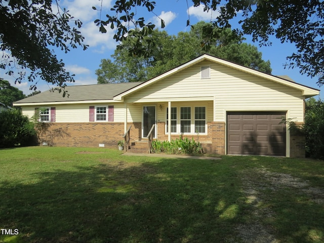 ranch-style home with a front lawn and a garage