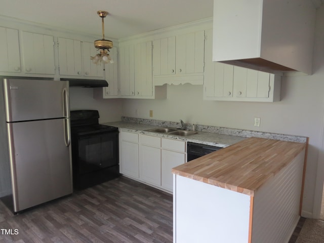 kitchen with hanging light fixtures, white cabinets, dark hardwood / wood-style flooring, black appliances, and sink