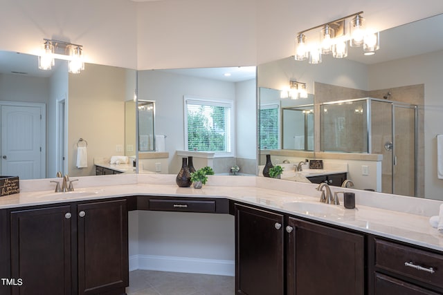 bathroom with vanity, tile patterned floors, and an enclosed shower