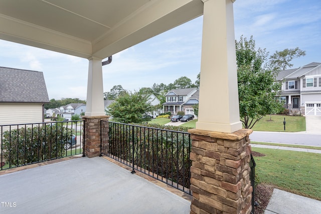 view of patio featuring a porch and a residential view