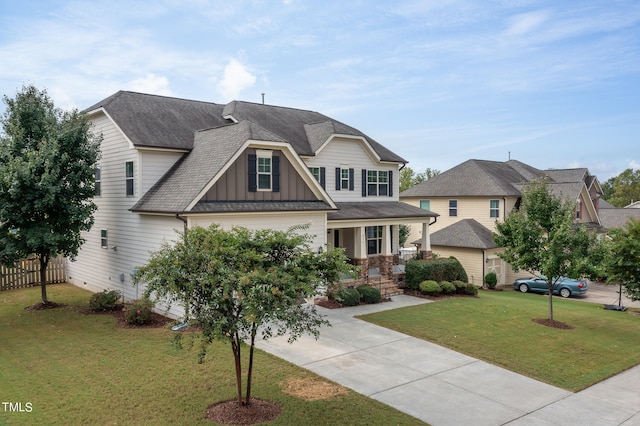 craftsman-style home with a front yard and a porch