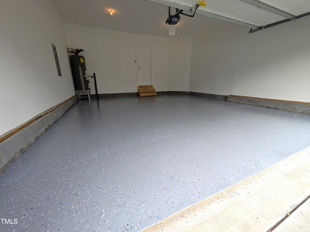 garage featuring electric panel, a garage door opener, and water heater