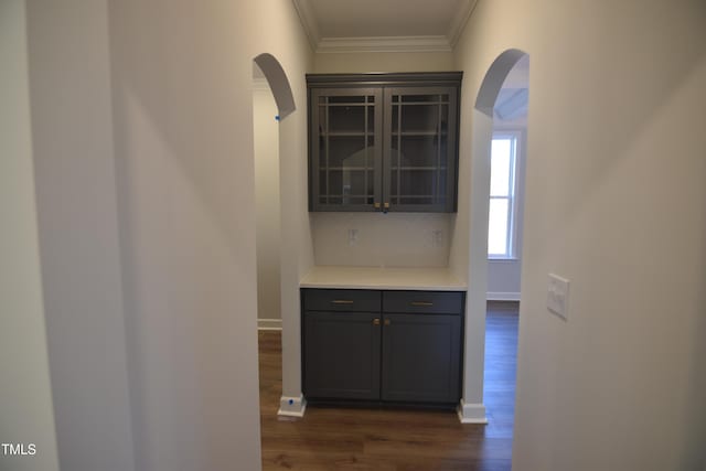 corridor with crown molding and dark hardwood / wood-style floors