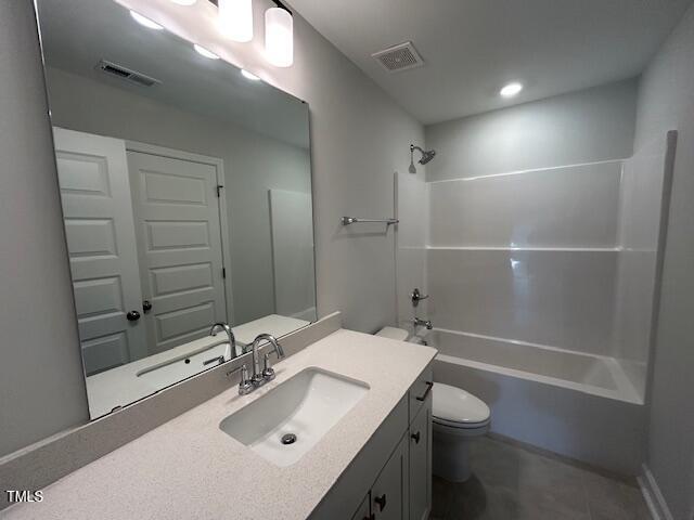 full bathroom with toilet, vanity, tile patterned flooring, and  shower combination