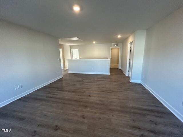 unfurnished room featuring dark hardwood / wood-style floors