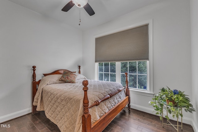 bedroom with ceiling fan and dark hardwood / wood-style flooring