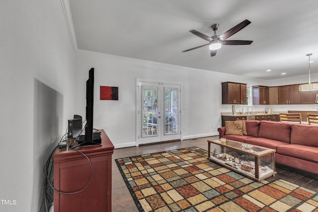 living room with ceiling fan, sink, french doors, dark hardwood / wood-style floors, and crown molding