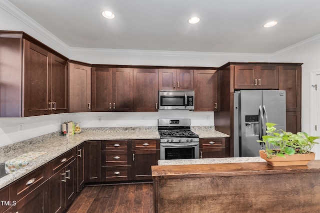 kitchen featuring dark brown cabinets, dark hardwood / wood-style flooring, stainless steel appliances, crown molding, and light stone countertops