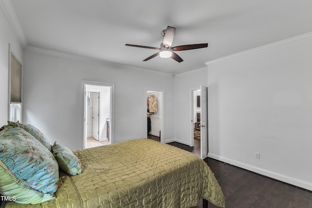 bedroom featuring crown molding, connected bathroom, dark hardwood / wood-style flooring, and ceiling fan