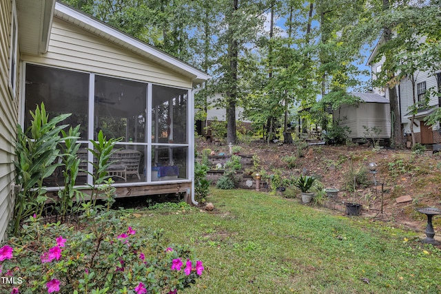 view of yard featuring a sunroom