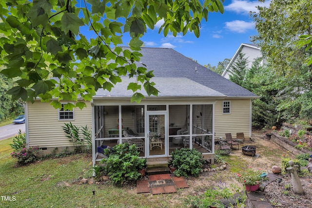 rear view of house with a sunroom