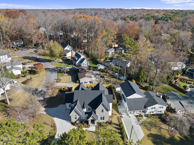701 Dartmouth Rd, Raleigh, NC 27609 - aerial overview of property's location with nearby suburban area and a heavily wooded area