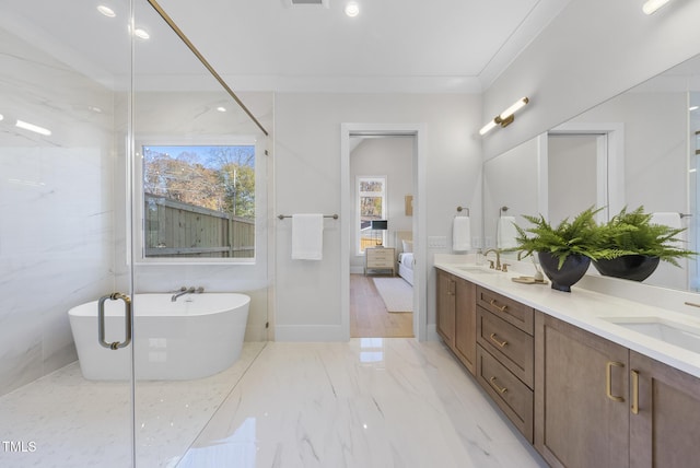 701 Dartmouth Rd, Raleigh, NC 27609 - ensuite bathroom featuring double vanity, a soaking tub, and marble finish floors