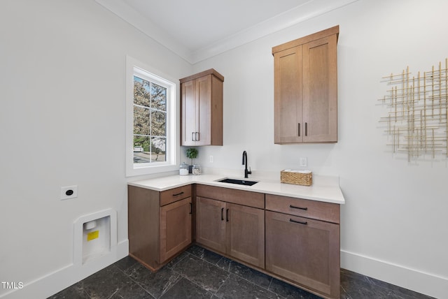 701 Dartmouth Rd, Raleigh, NC 27609 - laundry area featuring electric dryer hookup, cabinet space, baseboards, and crown molding