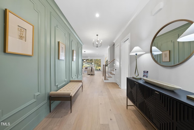 701 Dartmouth Rd, Raleigh, NC 27609 - corridor featuring light wood-style flooring, a chandelier, stairway, and recessed lighting