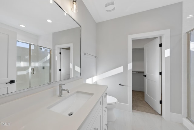 701 Dartmouth Rd, Raleigh, NC 27609 - bathroom with a stall shower, vanity, toilet, a walk in closet, and recessed lighting