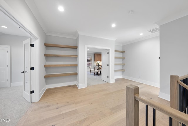 701 Dartmouth Rd, Raleigh, NC 27609 - hallway featuring ornamental molding, recessed lighting, baseboards, light wood finished floors, and an upstairs landing