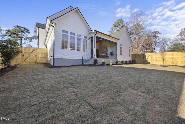 701 Dartmouth Rd, Raleigh, NC 27609 - rear view of house featuring a gate